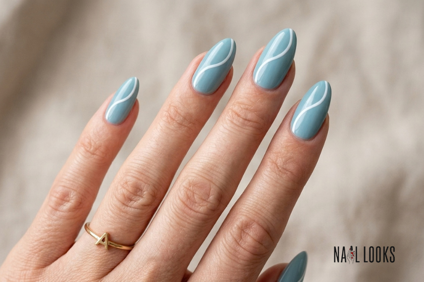 almond-shaped beach nails with wave design