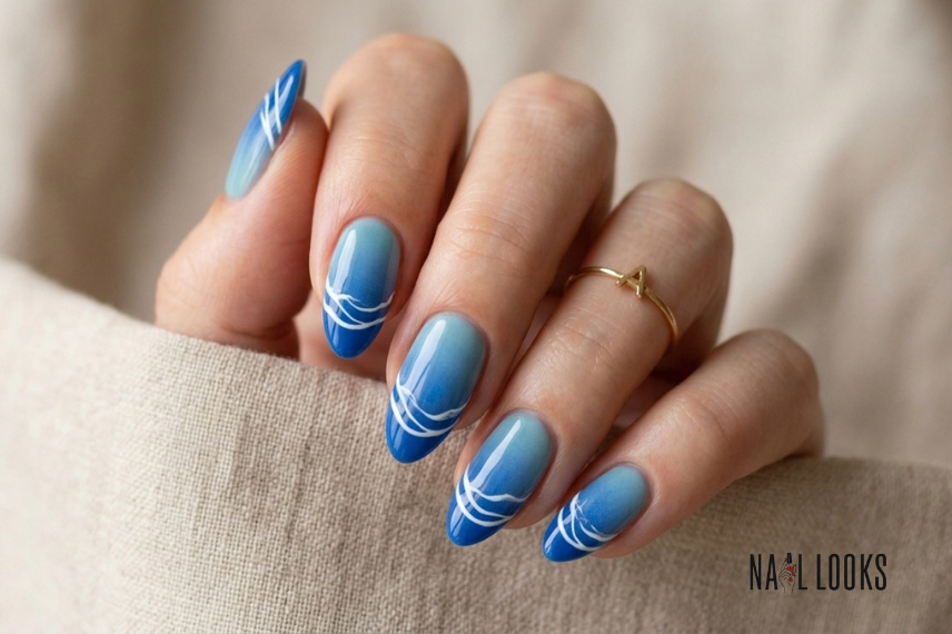 blue gradient ocean wave nail design