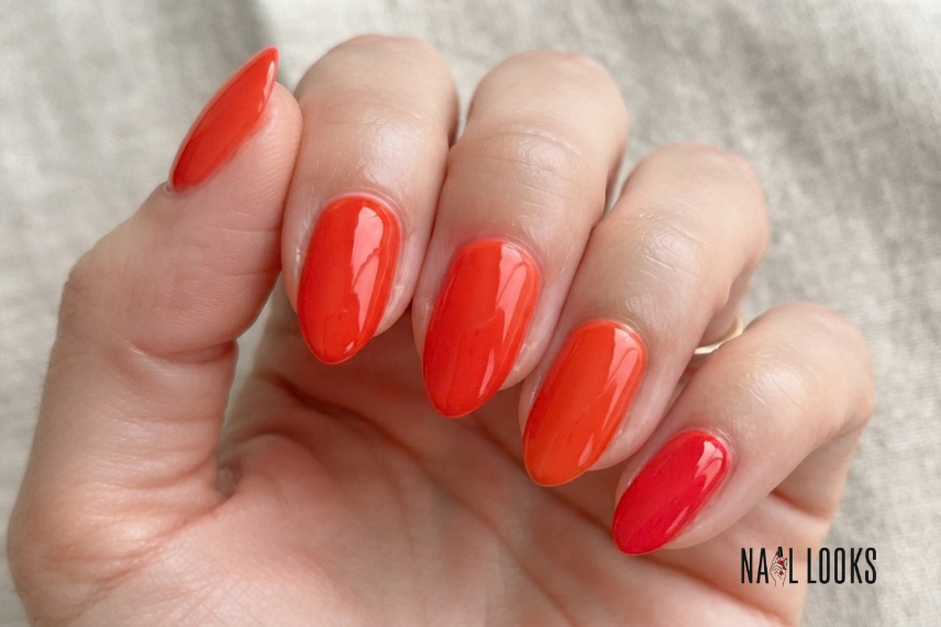 tomato red summer nails with a warm orange undertone